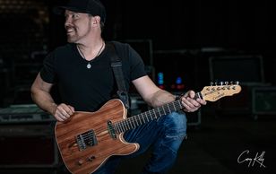 Award winning guitarist and producer Jason Barry with his signature series Tele Cithara Guitar.