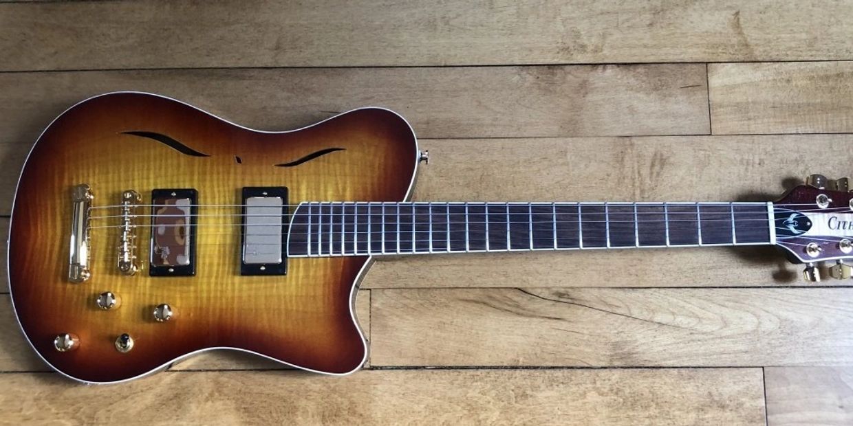 Patrick J. Clark's standard Cithara hollow-body guitar with a curly maple top.