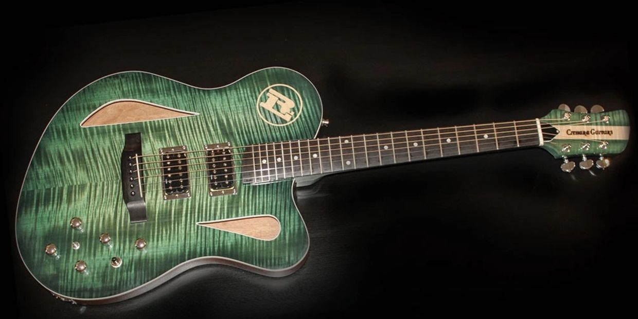 Ryan Laird's custom Cithara oversized hollow-body guitar with a mahogany body and curly maple top.