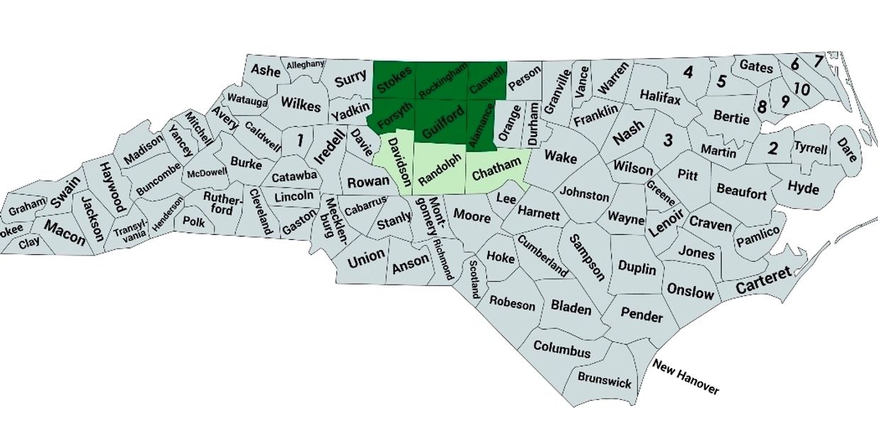 Map of North Carolina counties with specific counties highlighted in green.
