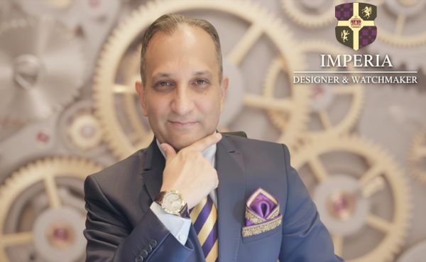 Portrait of a man in a suit with a watch and luxury background.