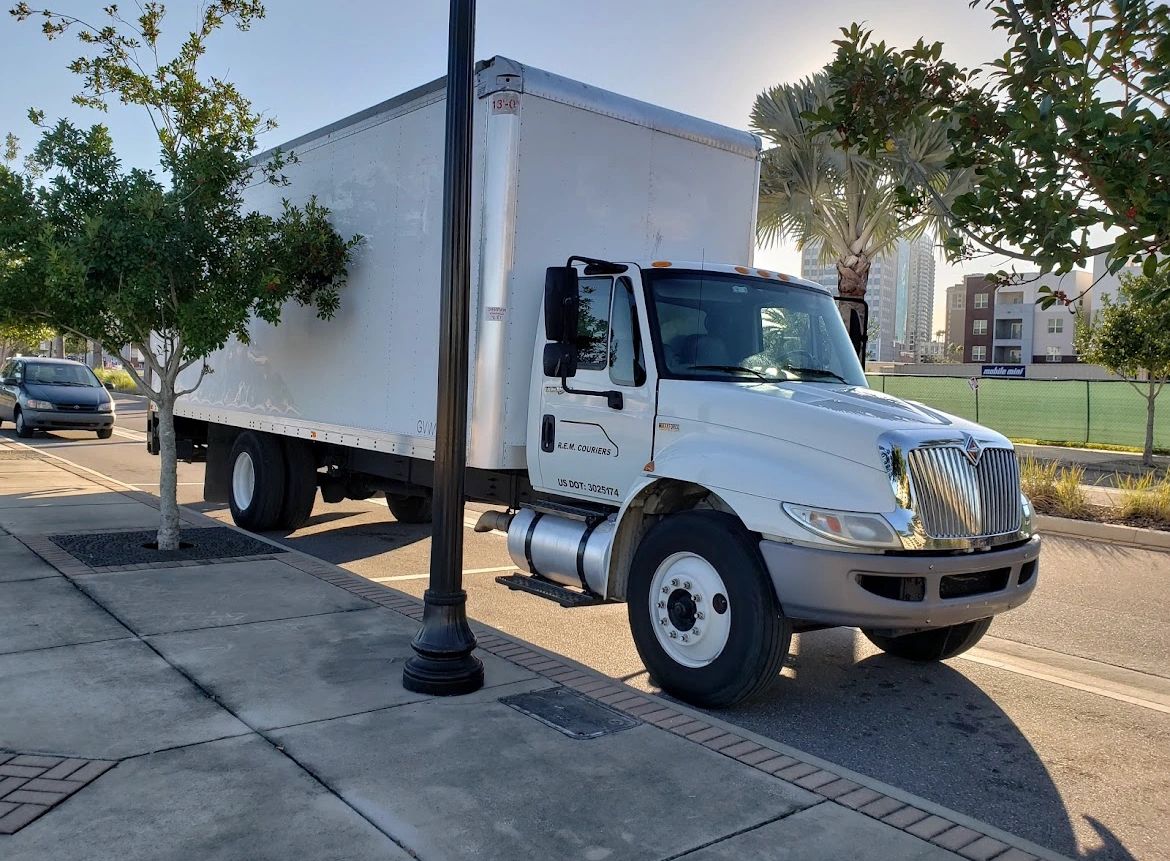 REM Courier Services Delivery Service, Courier, Trucking, Delivery
