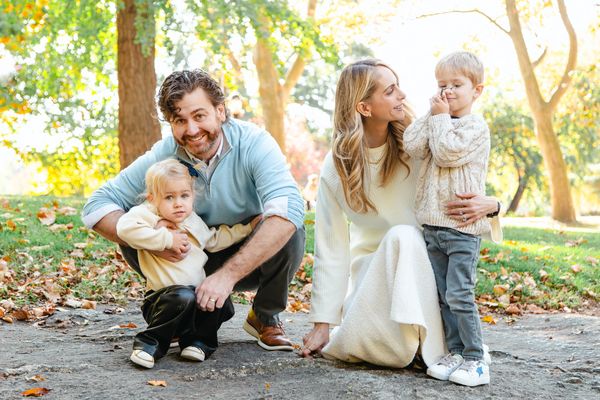 Happy family with two kids outdoors in autumn.
