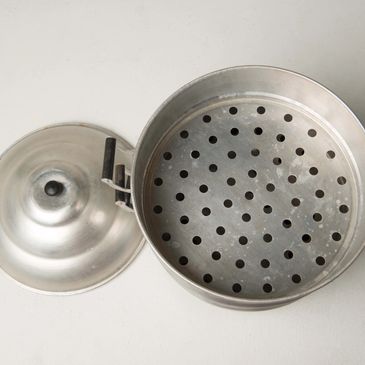 Steamer for cooking Peranakan Nyonya treats as part of installation, 'Re Turn'.