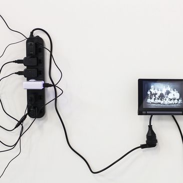 Moving images with cables and mobile communication devices as part of installation, 'Re Member'.