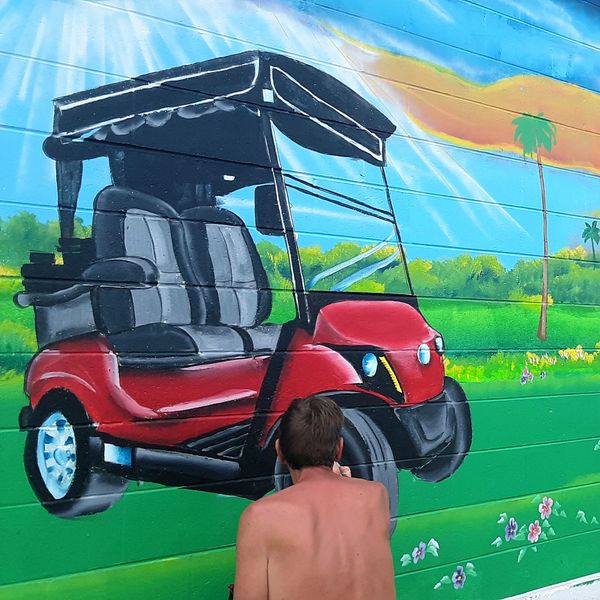 Painting a golf cart in Florida.