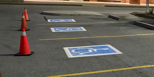 Jumbaloo indoor kids' fun center with accessible parking at night.