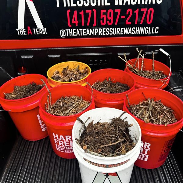 Professional gutter cleaning being performed by The A Team Pressure Washing in Springfield MO