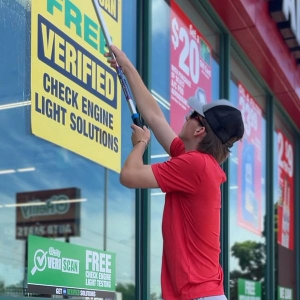 Professional window washing in progress using purified water in Springfield Missouri