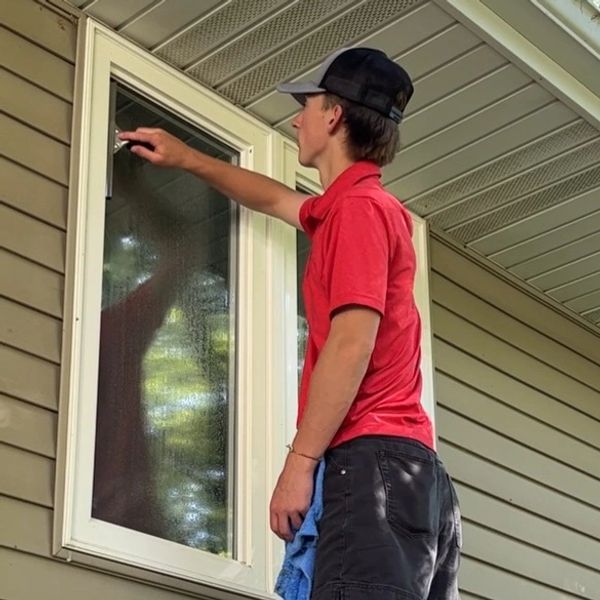 Dirty windows with pollen and water spots before professional window washing in Springfield MO