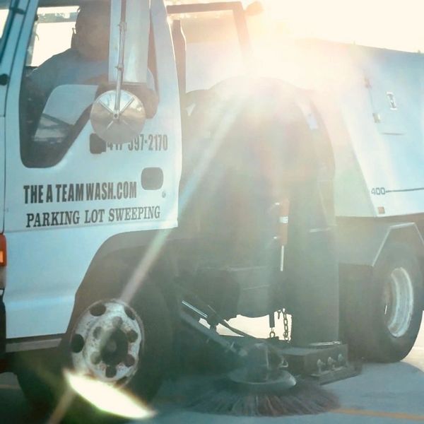 Parking lot sweeping in progress using street sweeper in Springfield Missouri
