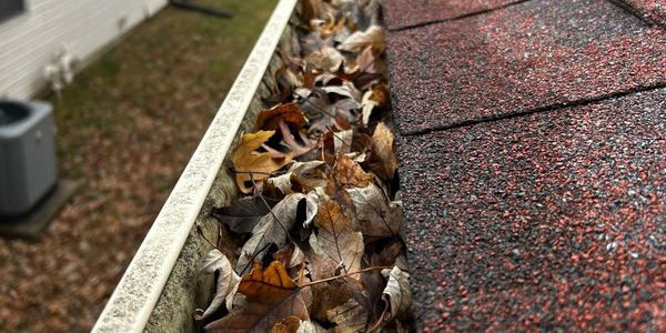 Gutters full of leaves that need cleaned out and gutter guards installed 