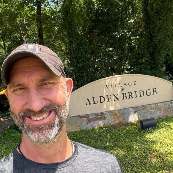Adam Taylor the Handyman standing in front of the Alden Bridge village entrance, The Woodlands, TX