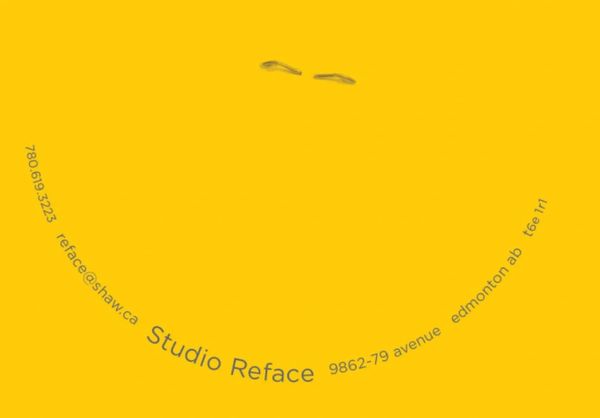 The reverse side of a staple forms the eyes of a happy face. The name & contact info form the mouth.
