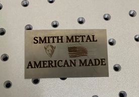 Laser engraved part with our company name, logo and the United States Flag on it. 