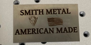 Laser engraved part with our company name, logo and the United States Flag on it. 