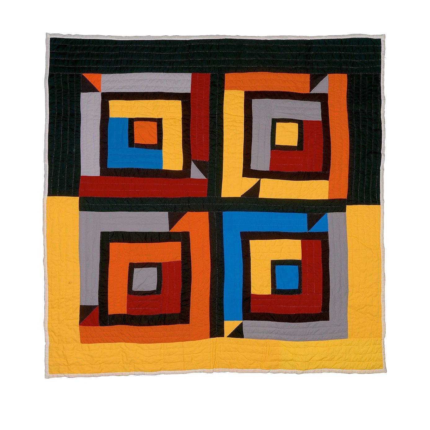 Colorful geometric quilt with squares and triangles.