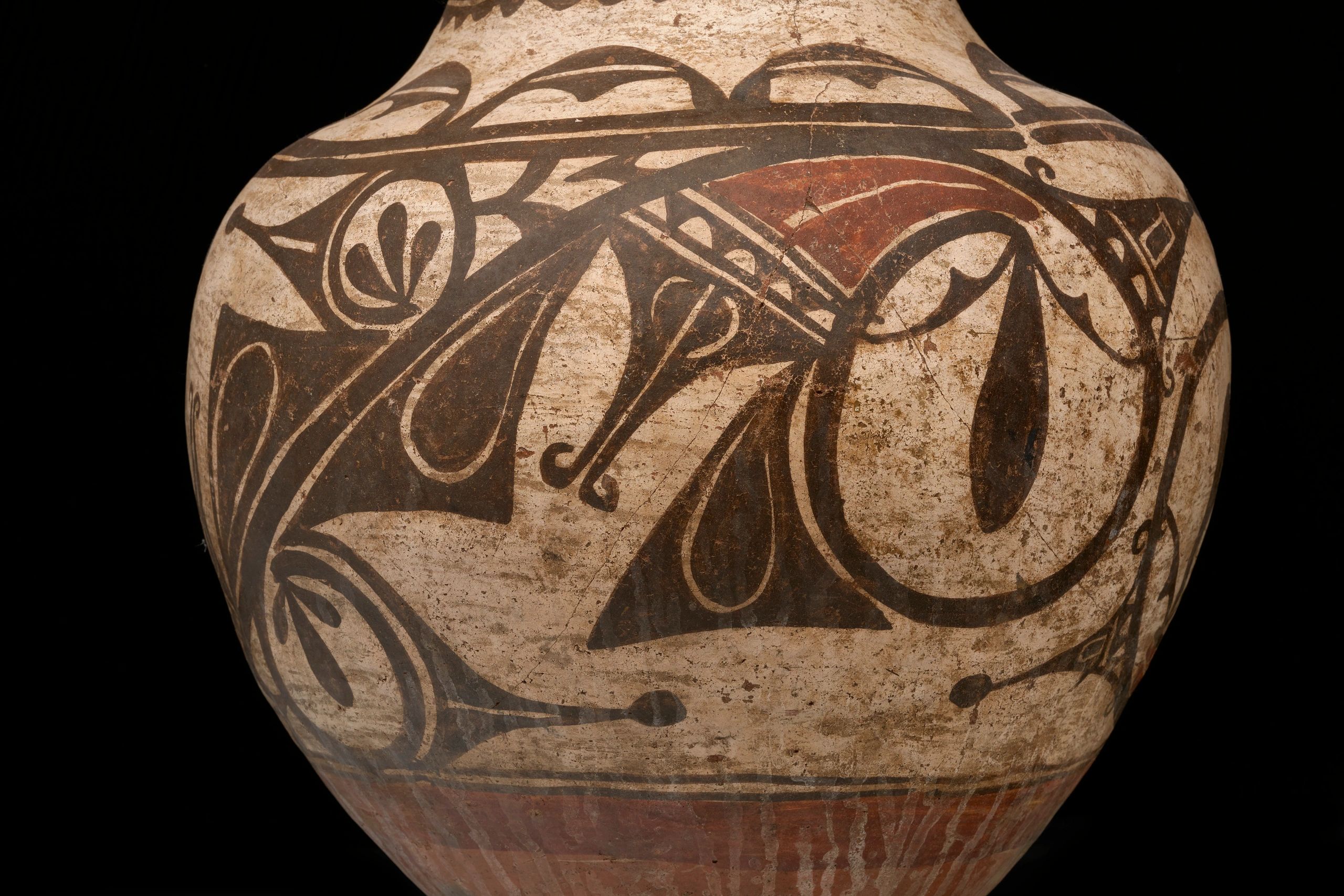 Close-up of a decorated pottery vessel.