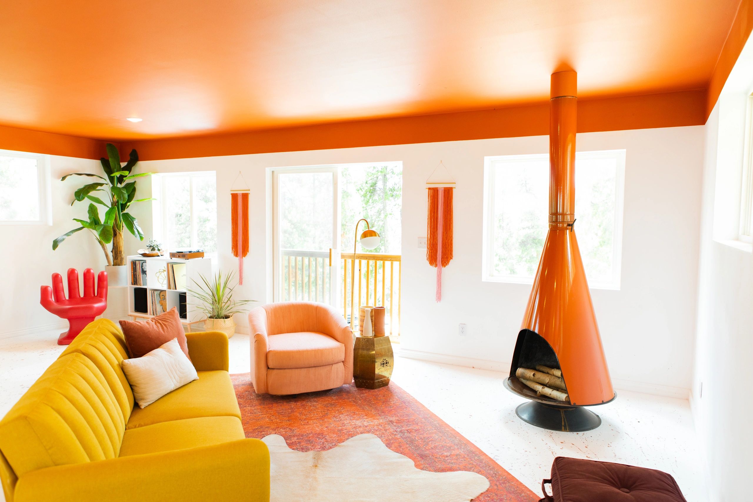 Orange and red living room with fireplace.