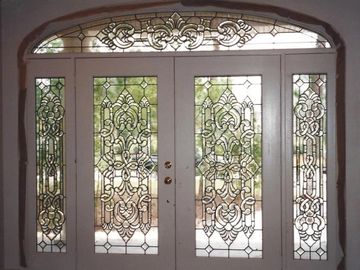 Stained glass on double entry door, 2 side panels and top panel. 