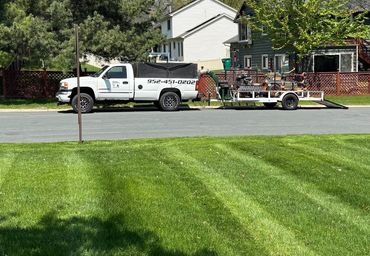 The mowing truck behind a yard we just mowed