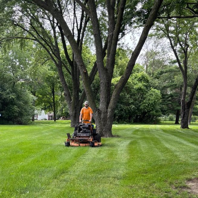 One of our employees mowing a lawn in Bloomington.