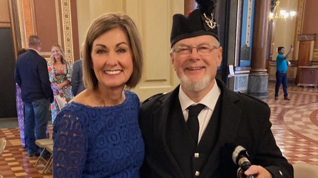 Photo with Iowa Governor Kim Reynolds at the Iowa Capitol Building.