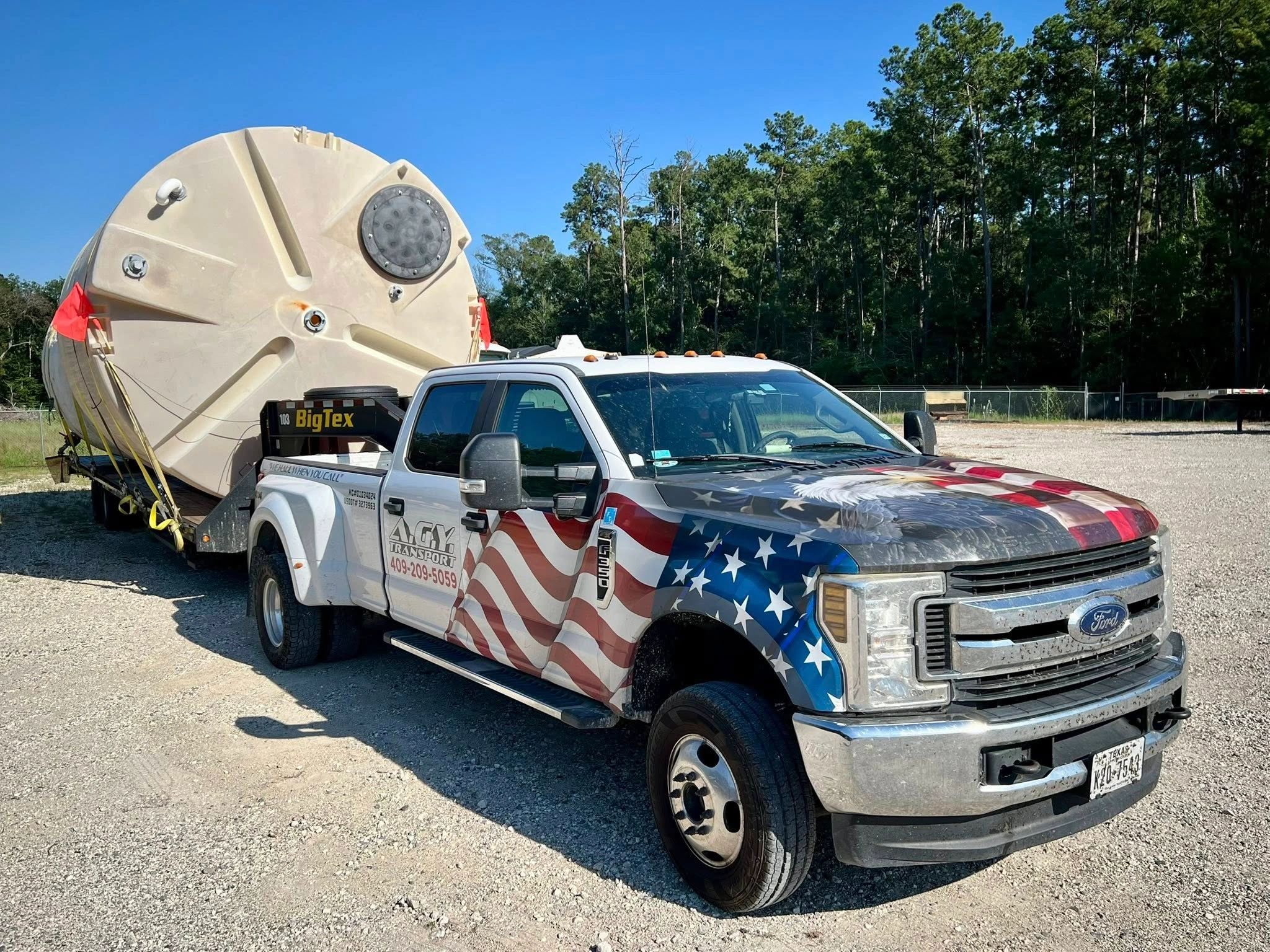 AGY Trucking Company hauling a tank in Kountze, Texas.