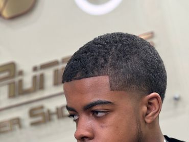 A young man in a barber shop