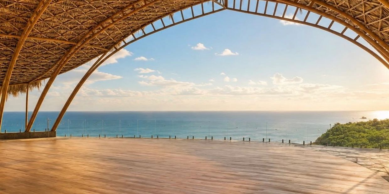 Open wooden structure overlooking the ocean at sunset.