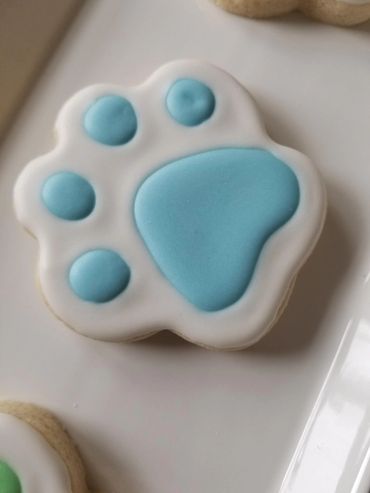 Puppy paw print decorated sugar cookie