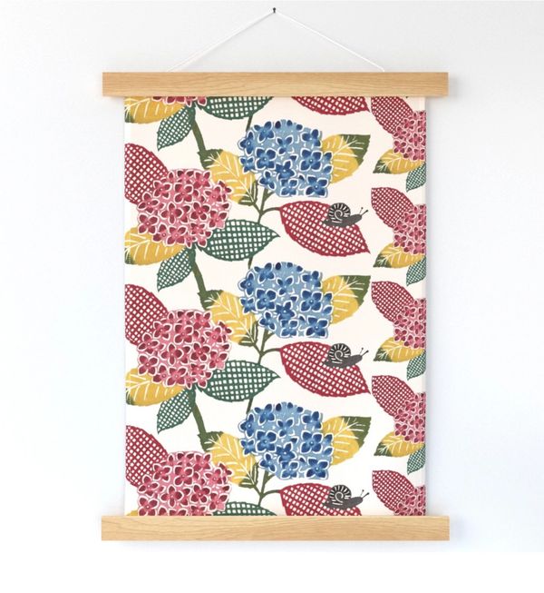 A wall hanging featuring 'Hydrangea (multi color)' textile design by Keiko Okamoto