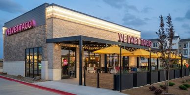 Velvet Taco restaurant exterior at dusk.