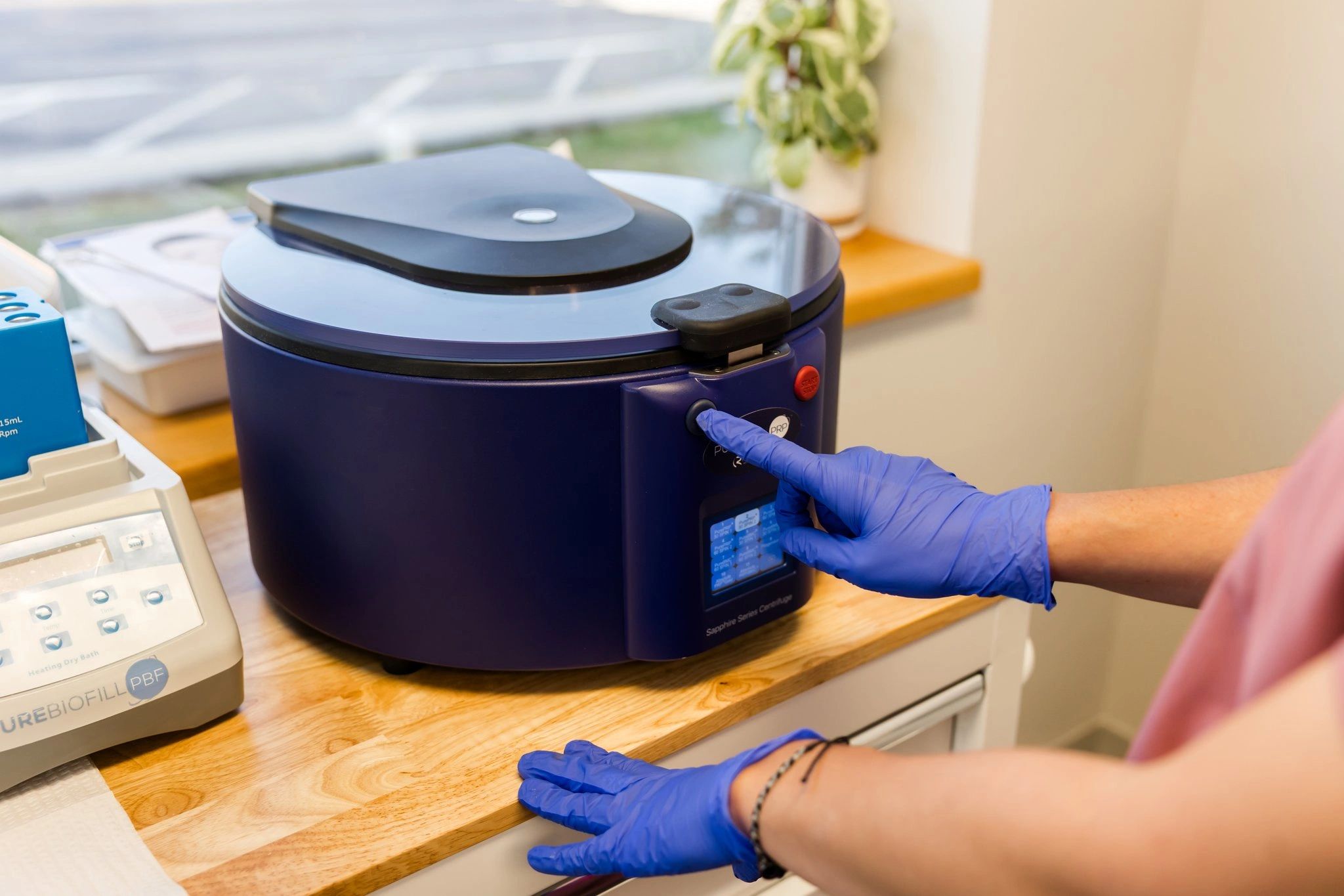 Spinning PRP in a centrifuge in South Portland Maine at MOTOX skin science.