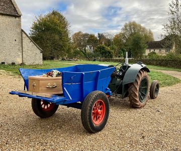 Tractor and trailer used at a funeral