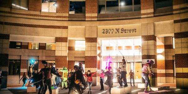Silent disco dancers outside an office
