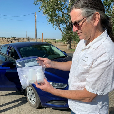 Man holding a water sample