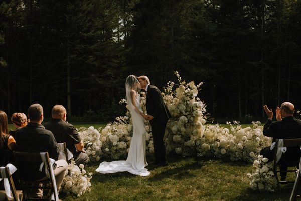 Bride and groom at the flower alter