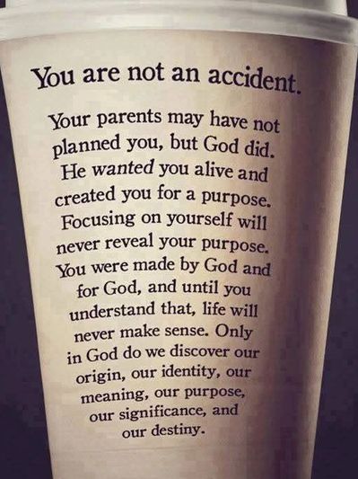 Inspirational message on a cup about life's purpose and divine creation.