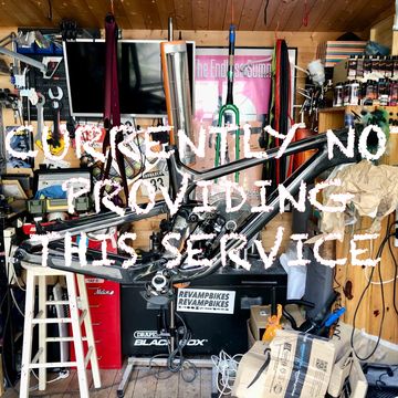 Messy bike workshop with text overlay.