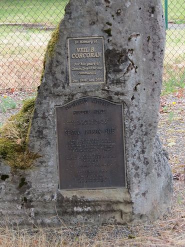 Memorial stone with plaques honoring Neil B. Corcoran and the Seattle Prison Site.