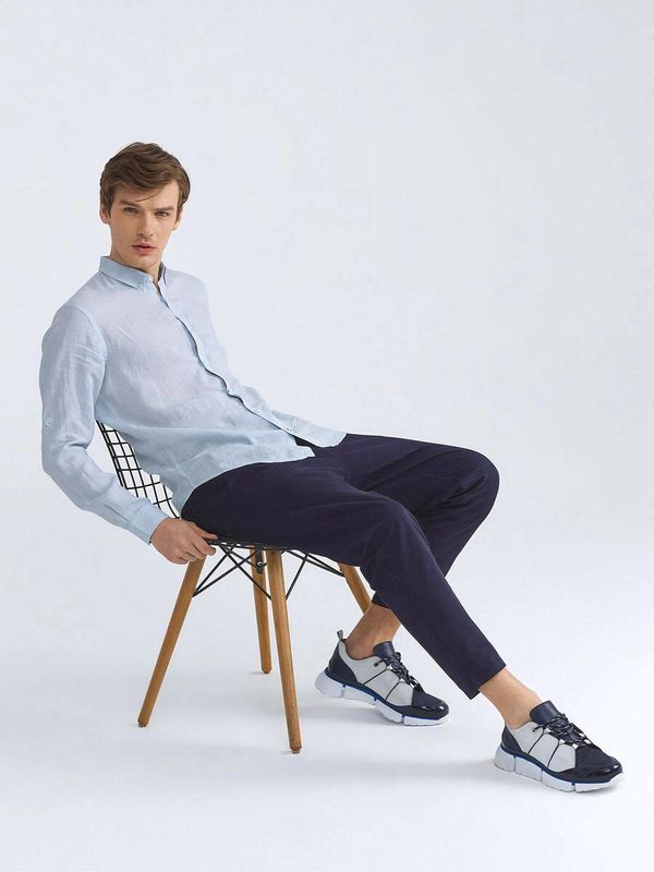 Male model wearing men's linen shirts at XluX menswear.