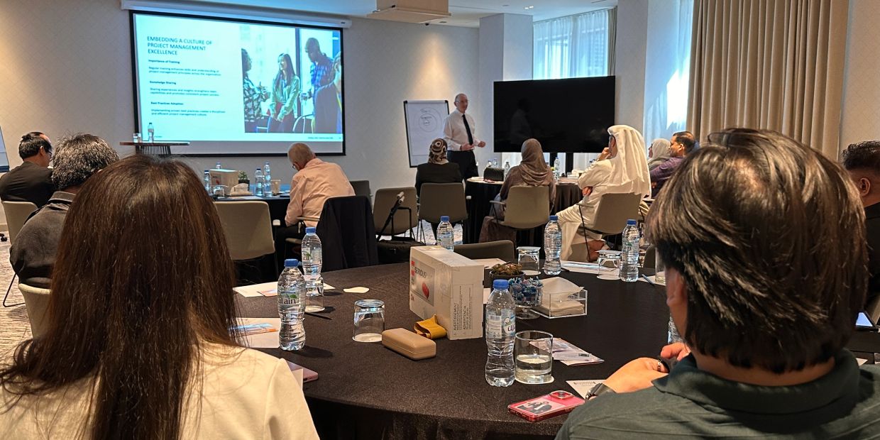 People attending a project management training session.