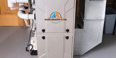Modern HVAC system installed in a clean basement.