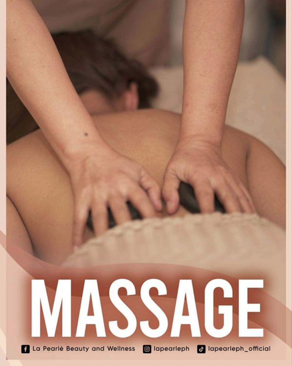 Hands giving a back massage.