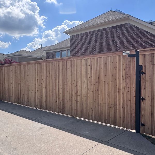  Custom cedar fence and driveway gate installation in DFW by Art Construction Corp.