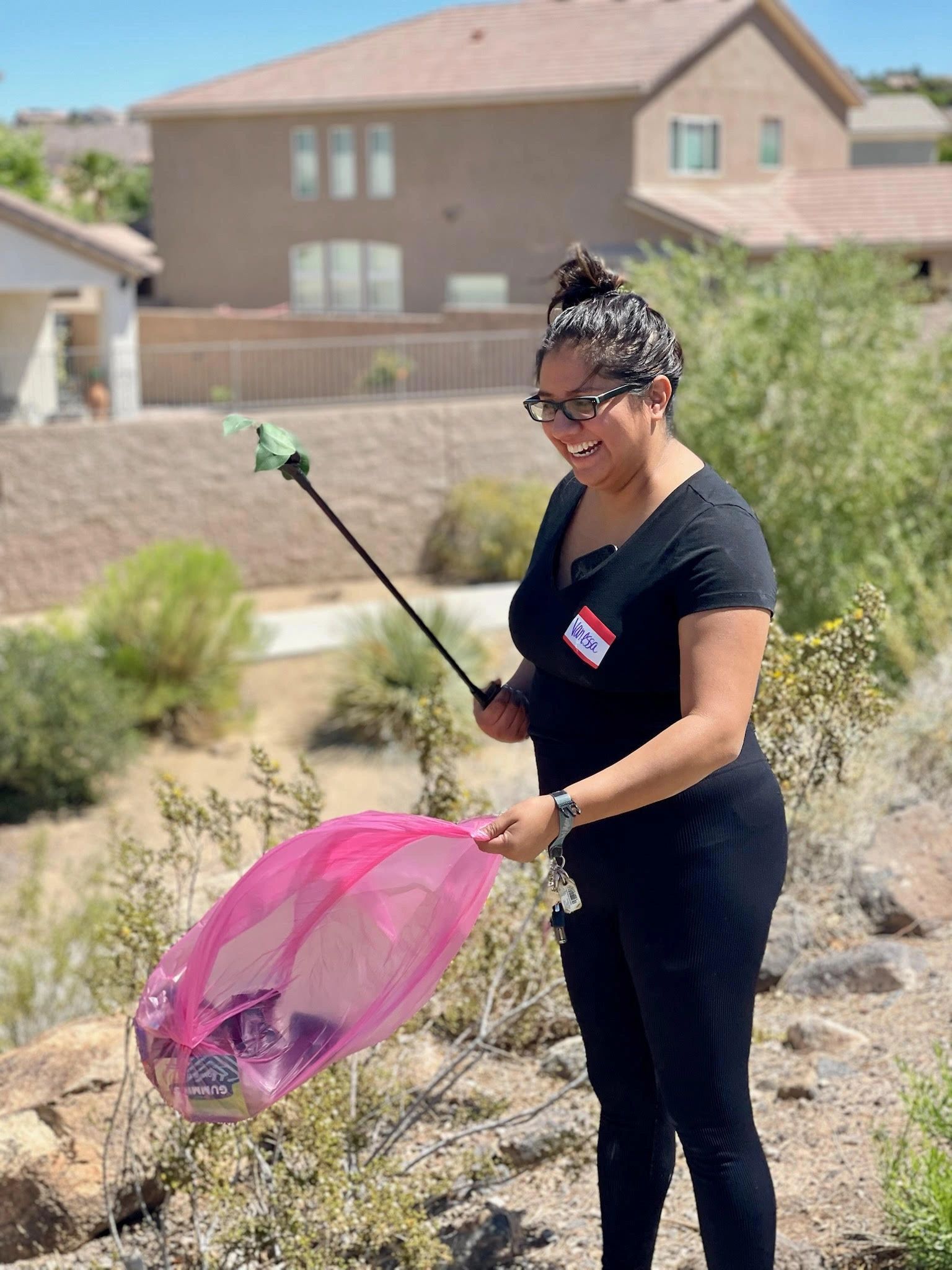 Volunteer collecting trash  at a park