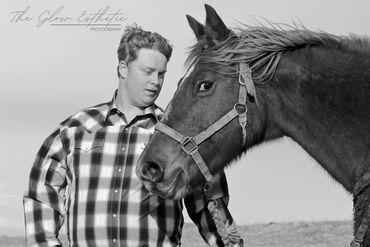 Black and white senior photo with horse, outdoors. Missoula, Montana photographer.