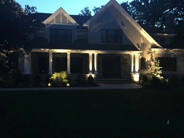 view of a house with lights on 