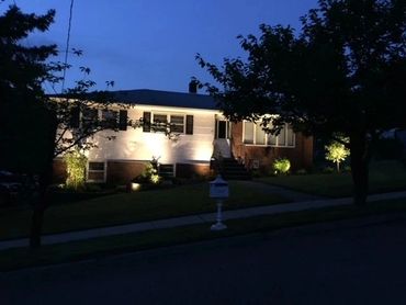 a house with lights on at night